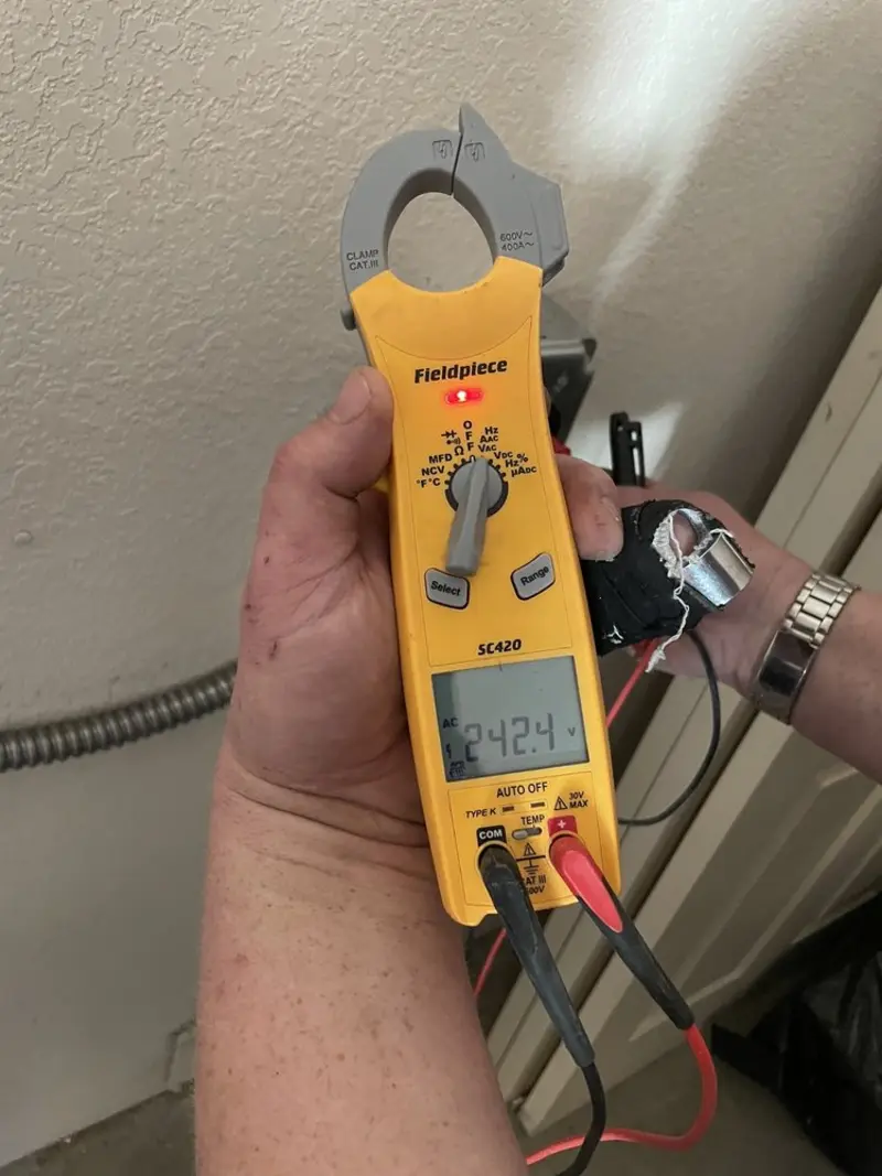 Voltage testing with clamp meter during Whole House Surge Protector in Whiteville